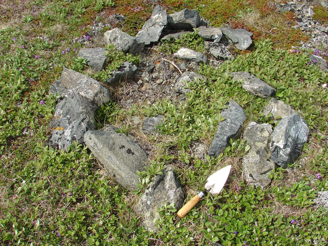 A ring of rocks marks the likely location of a cross, erected by French fishermen at the highest point of le Sommet de la Croix (The Summit of the Cross).